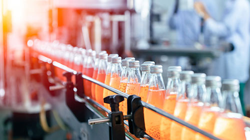 Drink factory production line fruit juice beverage product at conveyor belt